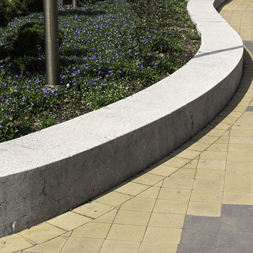 Precision concrete curbing edging in Aurora, defining garden and lawn boundaries neatly