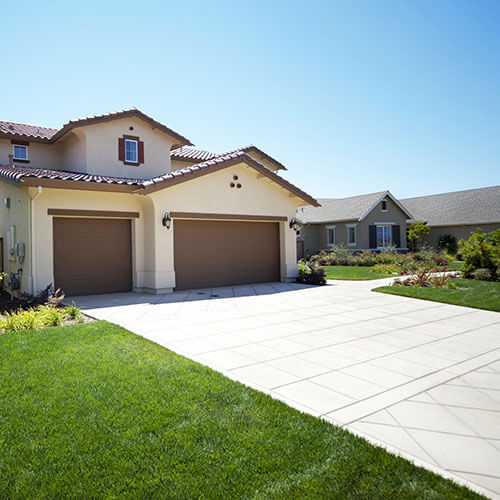 Newly installed concrete driveway in Aurora, CO, showcasing durability and smooth finish